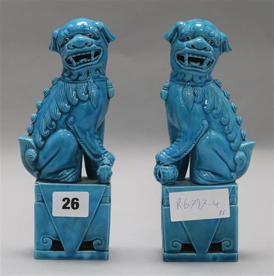 A pair of turquoise dogs of fo height 20cm (some damage)